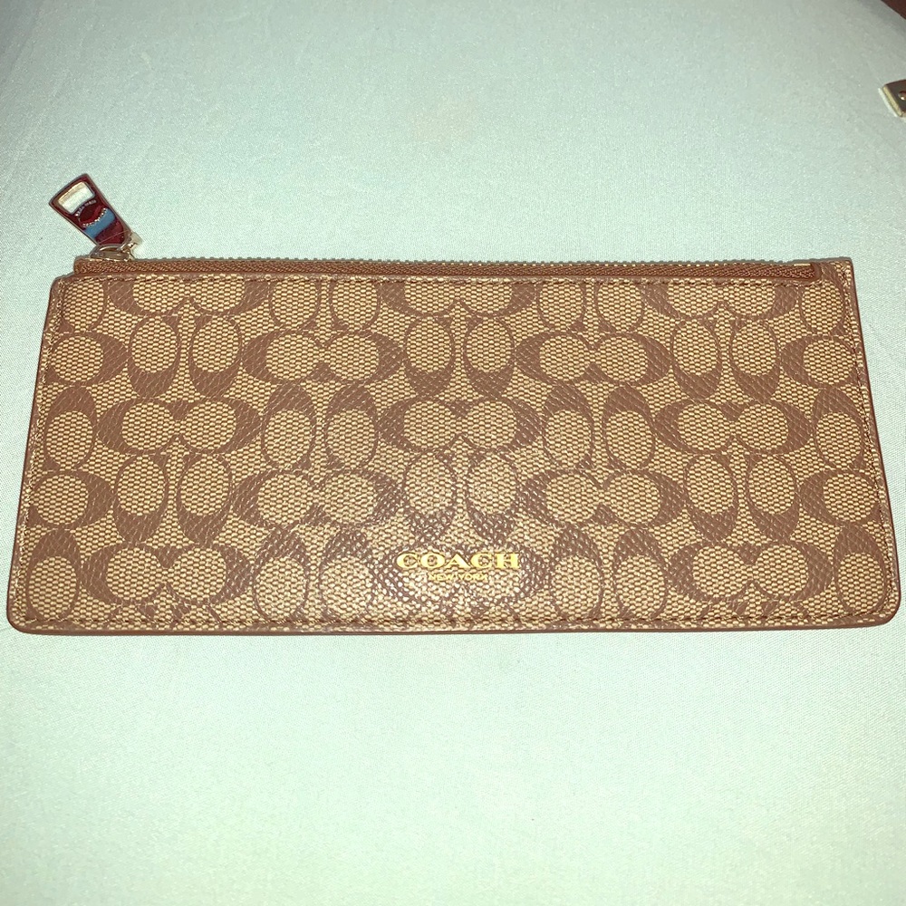 Adorable Coach Pouch.